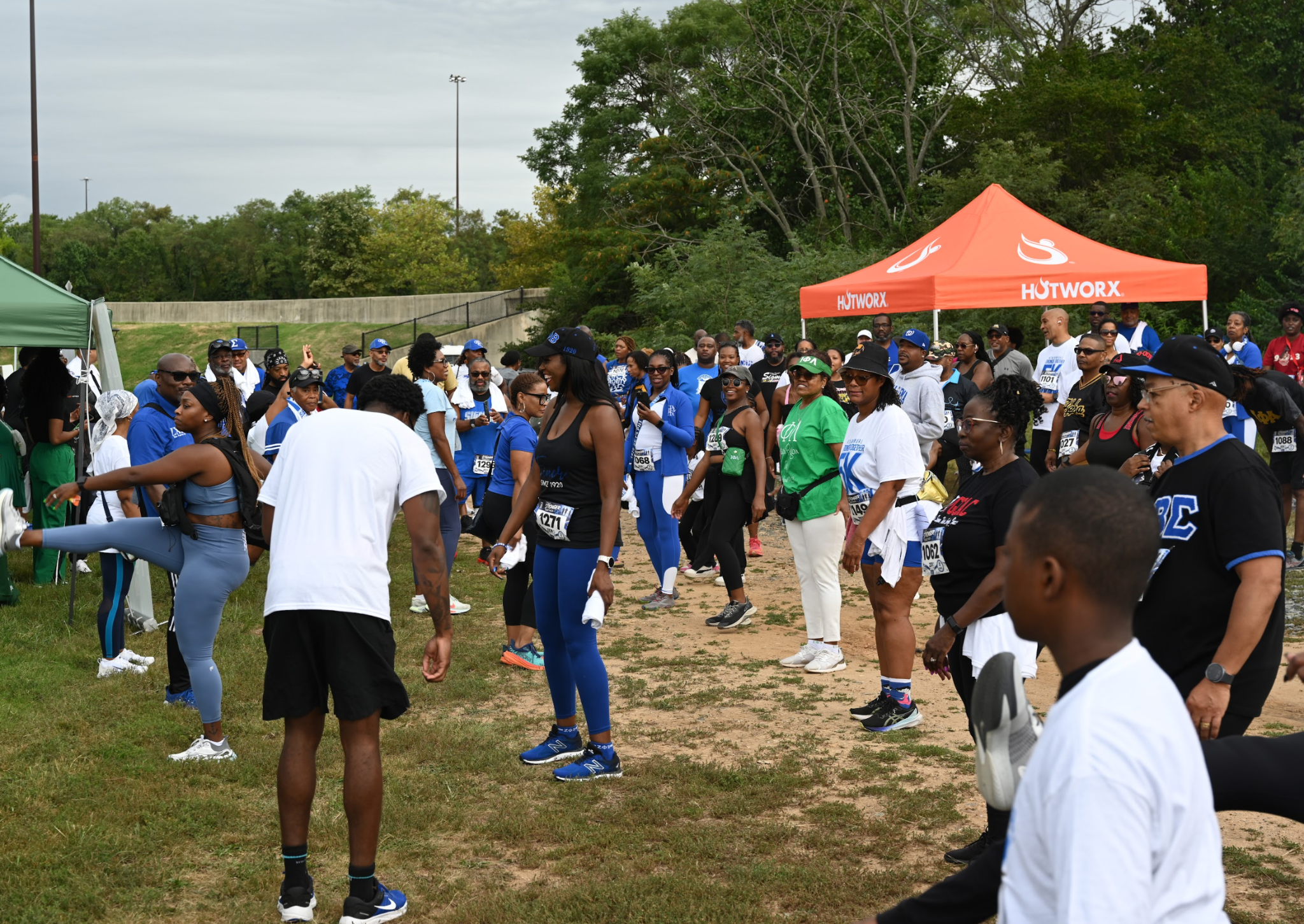 Neighbors and participants gathering outdoors at the Stronger Together 5K